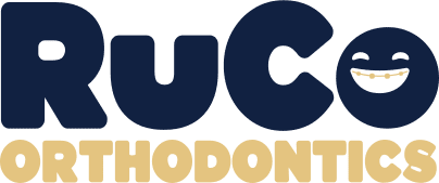 RuCo Orthodontics logo with a smiling face.