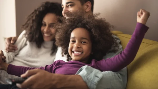 Family enjoying time together on the couch.